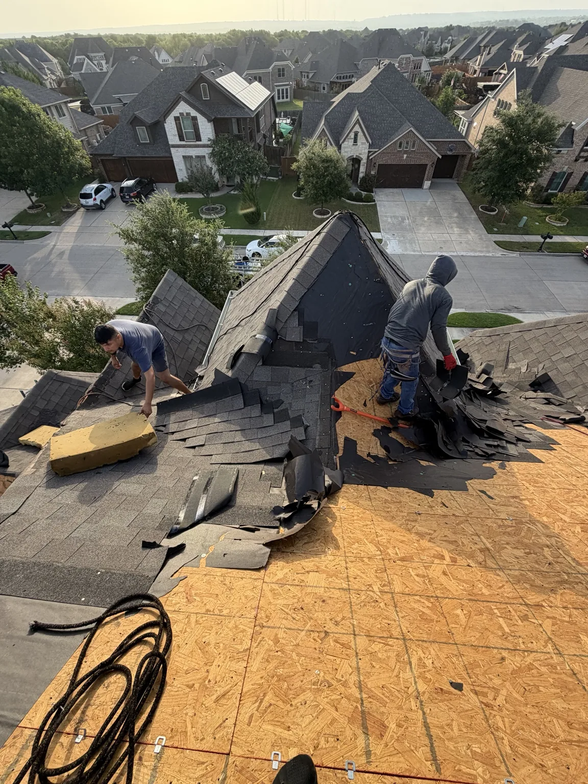 Crew documenting property damage on site