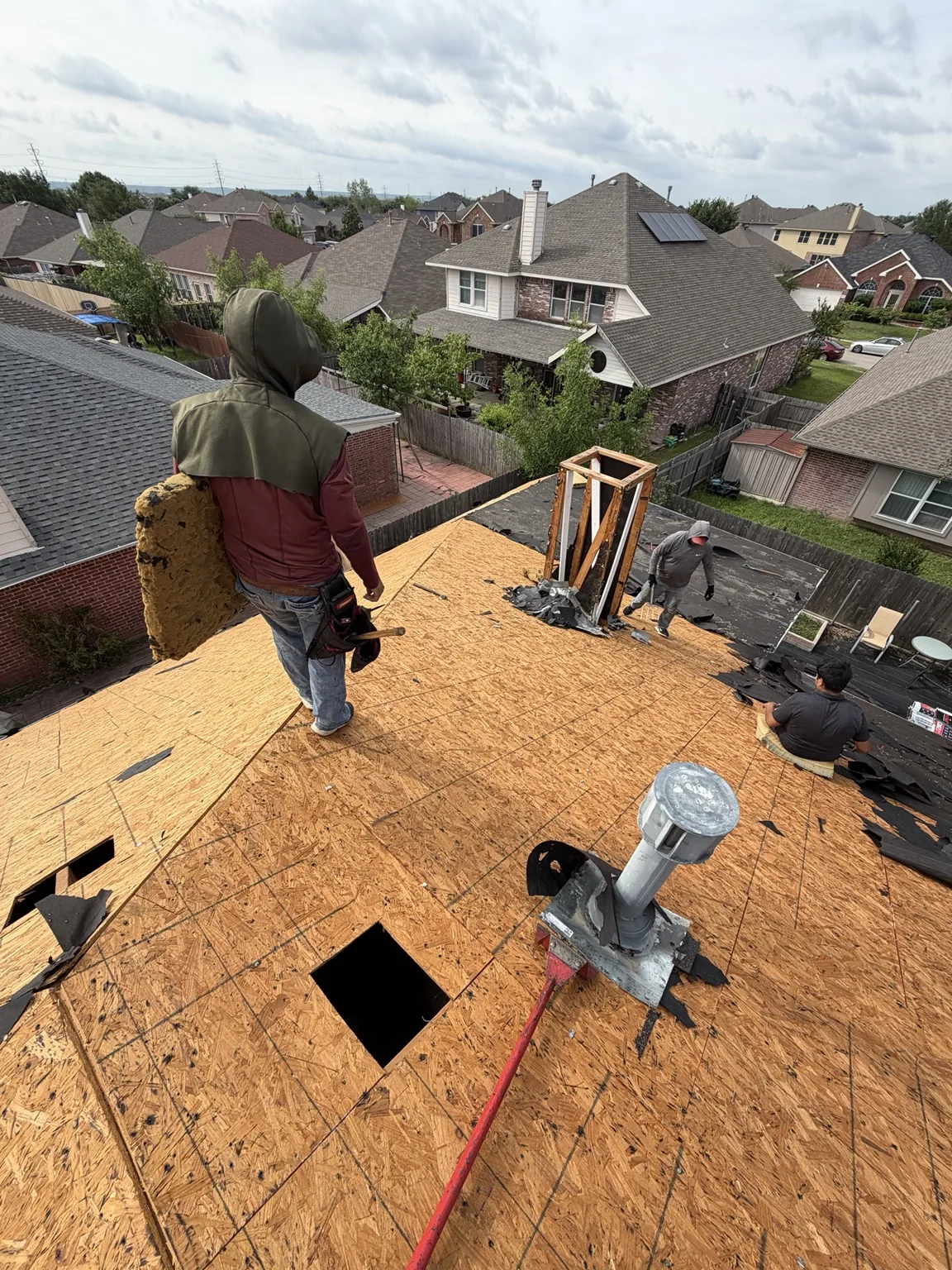Roof tear-off in progress